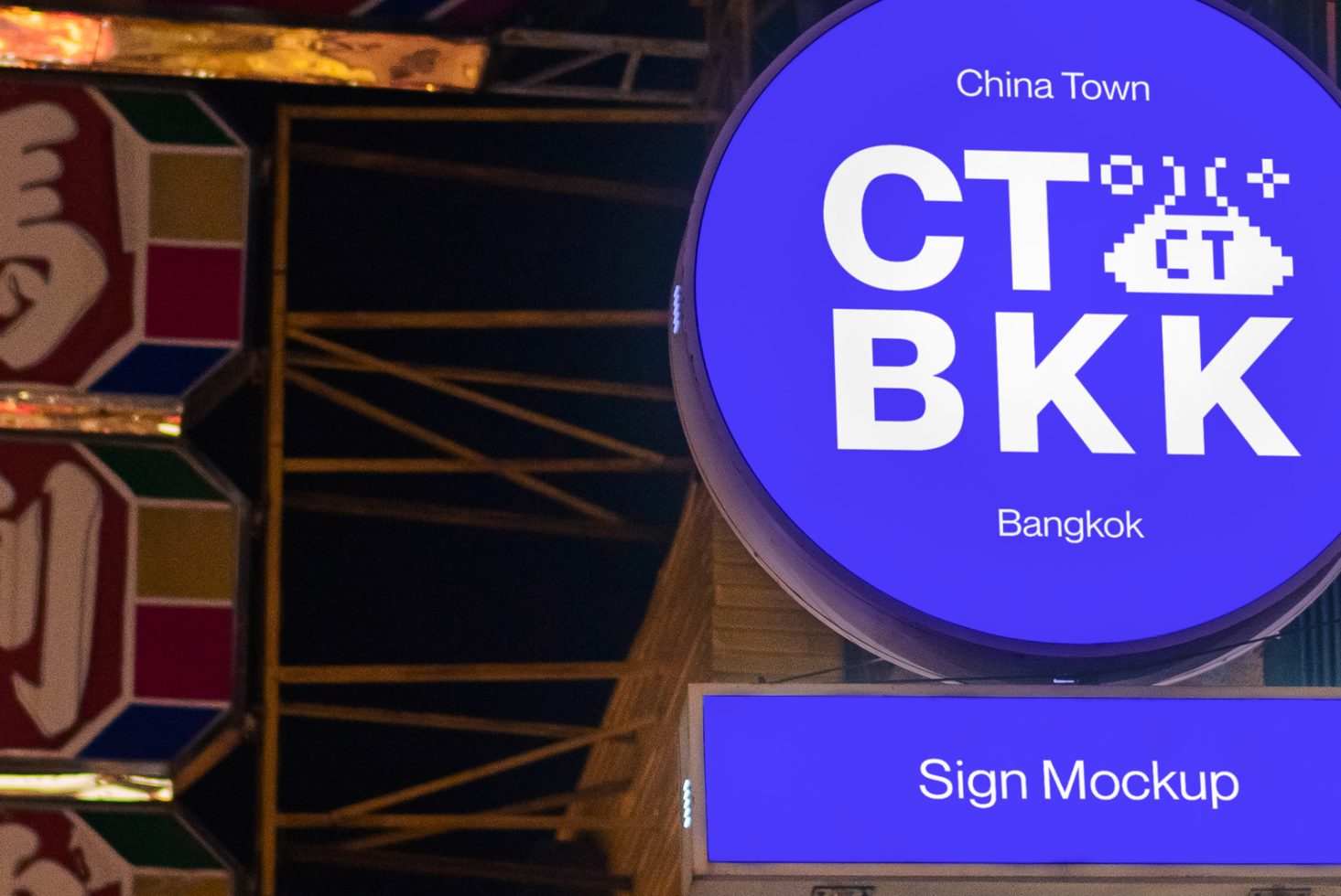 Illuminated circular sign mockup at night displaying text for China Town Bangkok, suitable for designers looking for urban sign graphics.